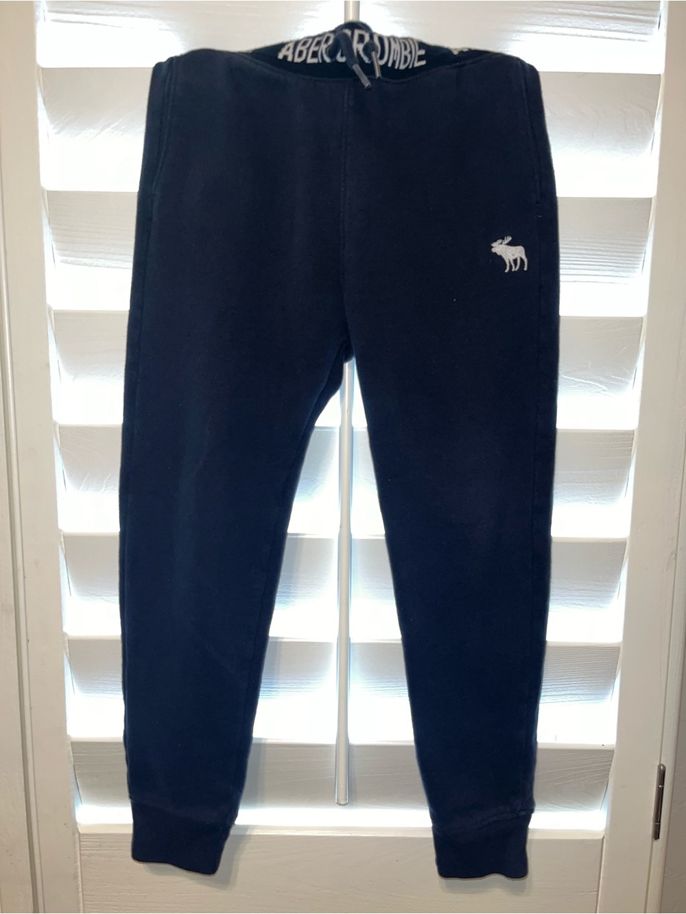 abercrombie kids navy jogger pants with white logo